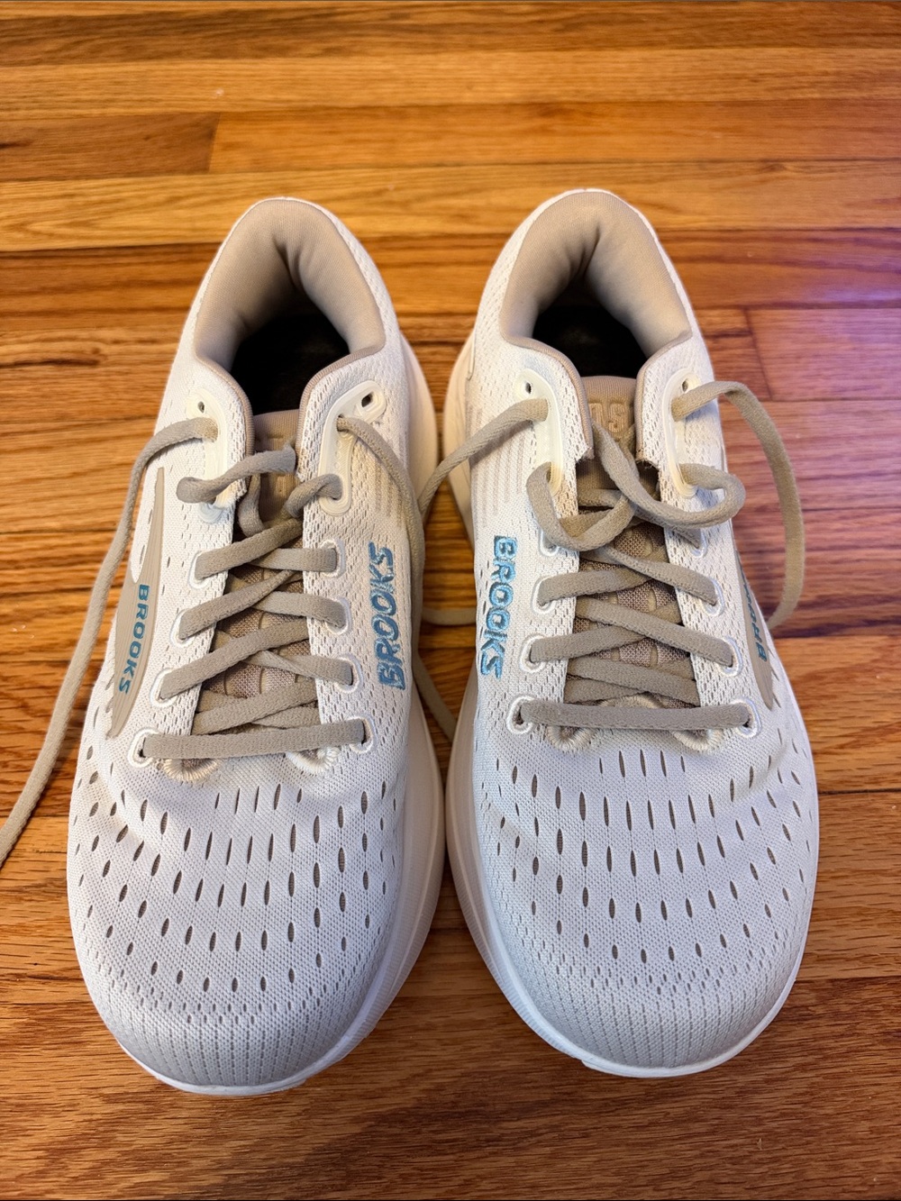 Brooks women White and Beige Athletic Running Shoes with Blue Logo